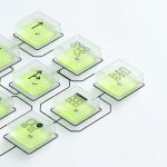 A series of interconnected translucent testing nodes arranged in a clean grid-like flow