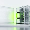 Two balanced translucent platform structures representing a Webflow and WordPress comparison