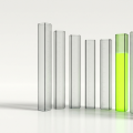 Eight tall translucent glass gauge columns of different heights arranged in a gentle curved row on a clean reflective white floor, seven of them clear and softly frosted with faint measurement lines, one glowing with lime green